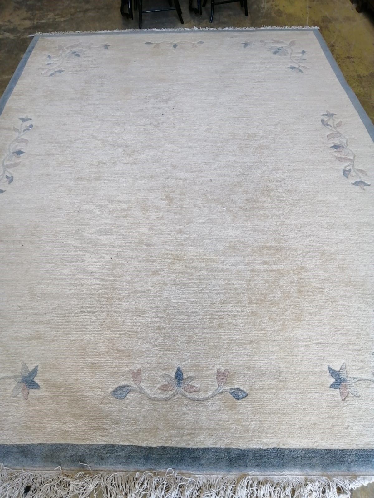 A Chinese beige ground carpet, 340 x 250cm